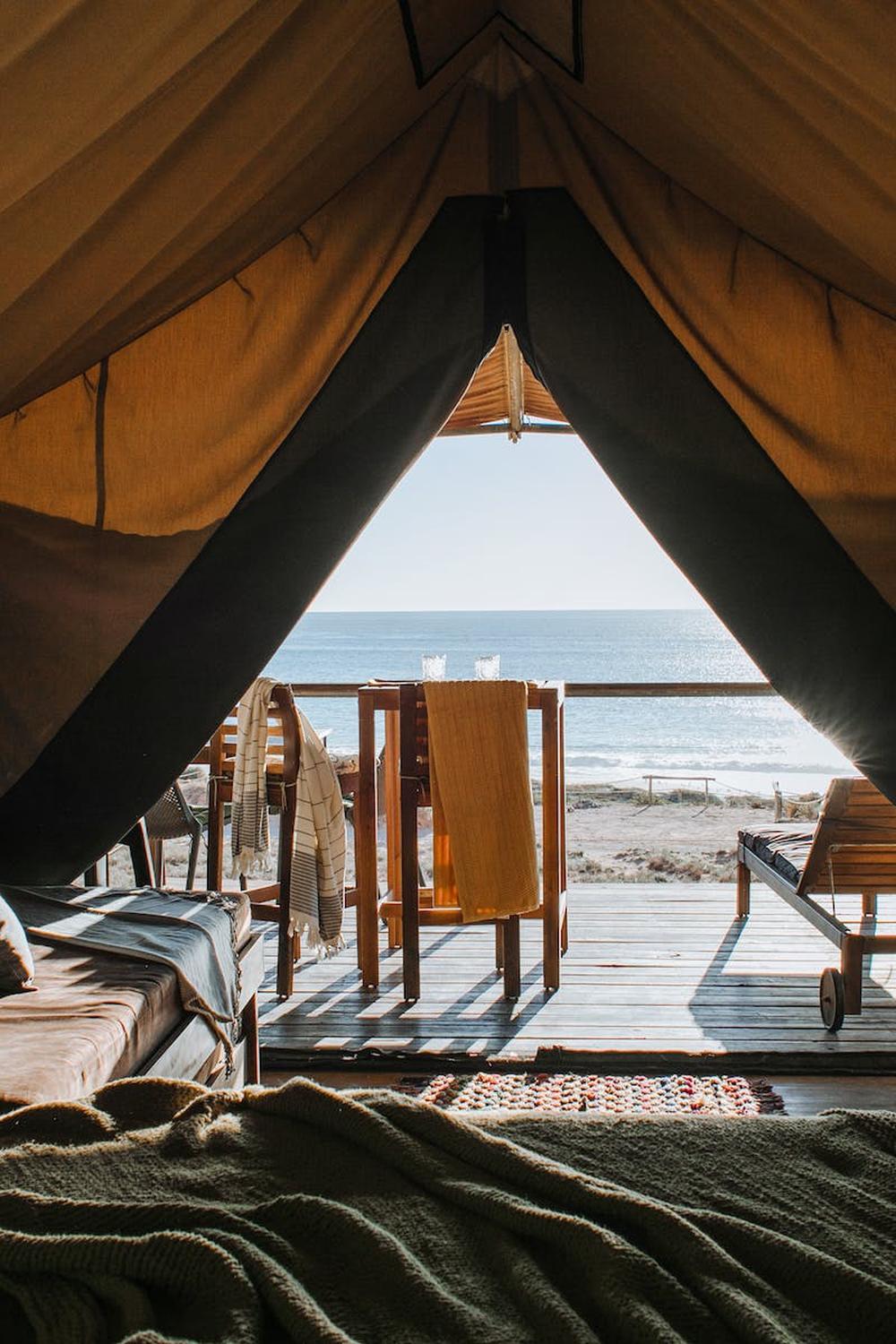 cozy_tent_with_bed_and_terrace_on_beach