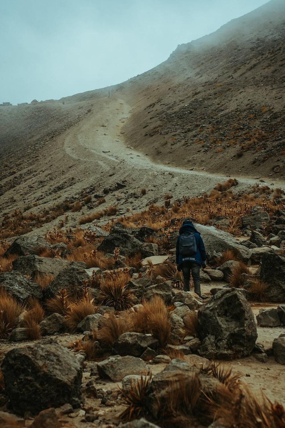 person_standing_near_rocks