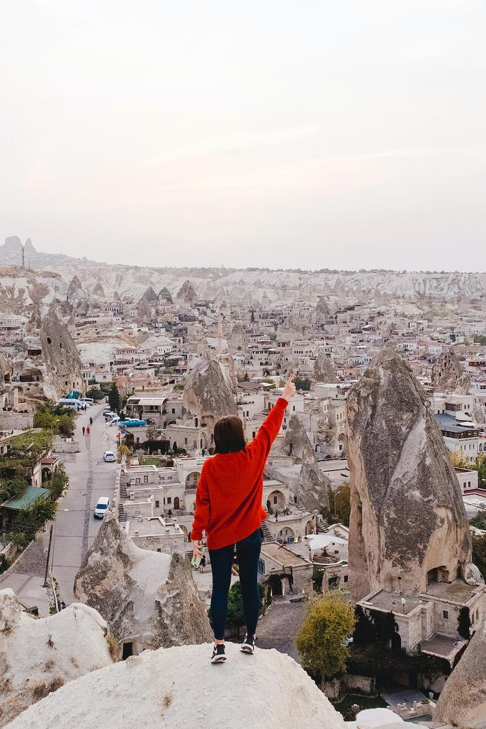 person_wearing_red_long_sleeved_shirt_standing_on_